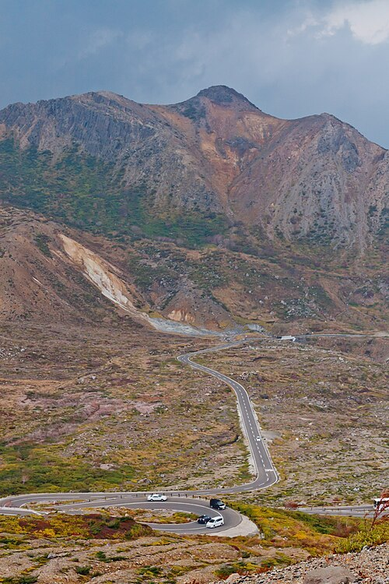 The Bandai-Azuma Skyline curves through the rocky Jododaira landscape beneath a steep mountainside.