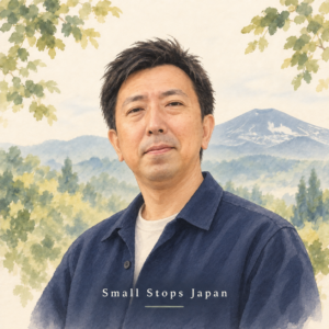Watercolor portrait of Ryo with an illustrated mountain landscape.