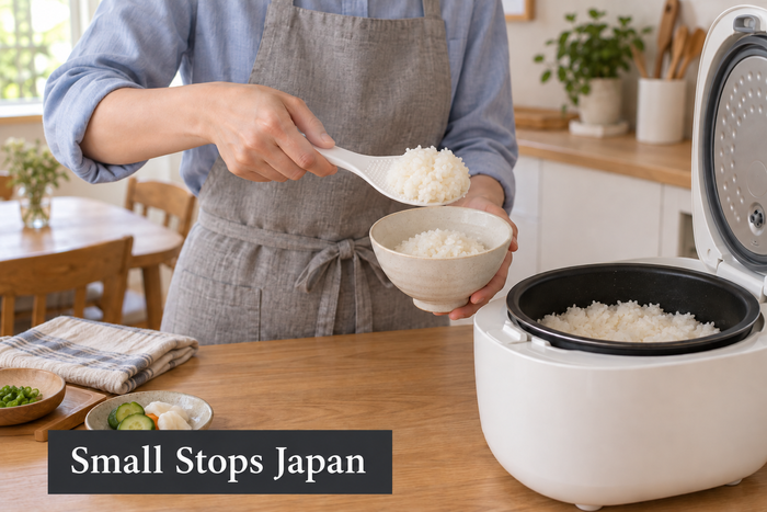 Illustration of an adult transferring cooked rice from a white paddle into a ceramic bowl, with the rice cooker beside their hands.