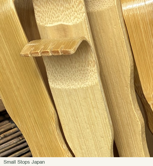 Close detail of curved bamboo tips with shallow cuts along their broad edges.
