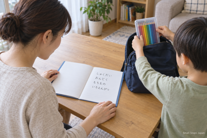 A parent reads an open notebook while a child puts a clear case of coloured pencils into an open backpack.
